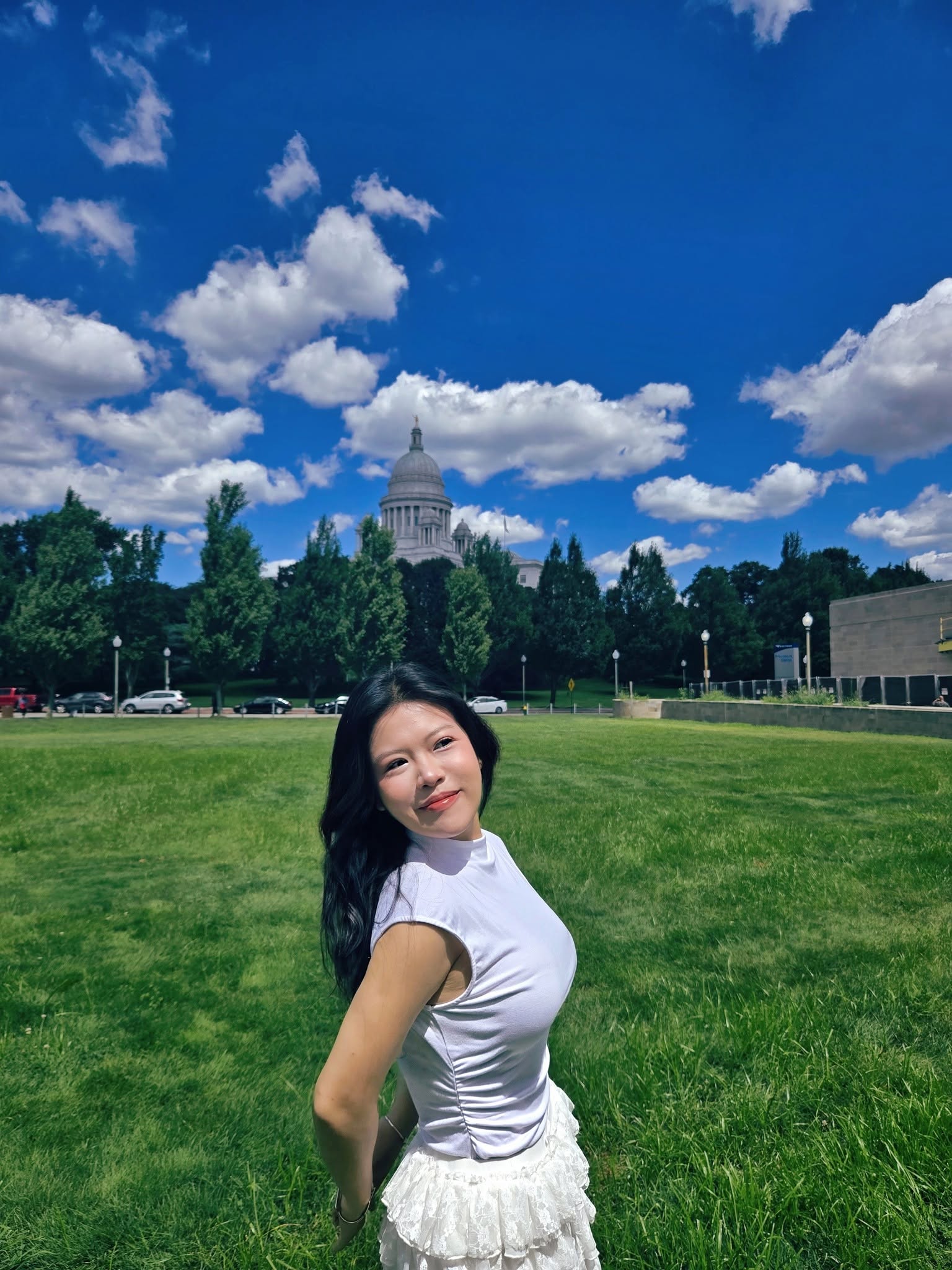 Linh Dinh standing on a sunny lawn in San Francisco